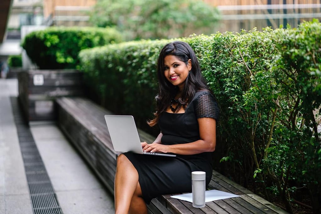 property-managers-for-airbnb-asian-woman-using-laptop-pretty-smile